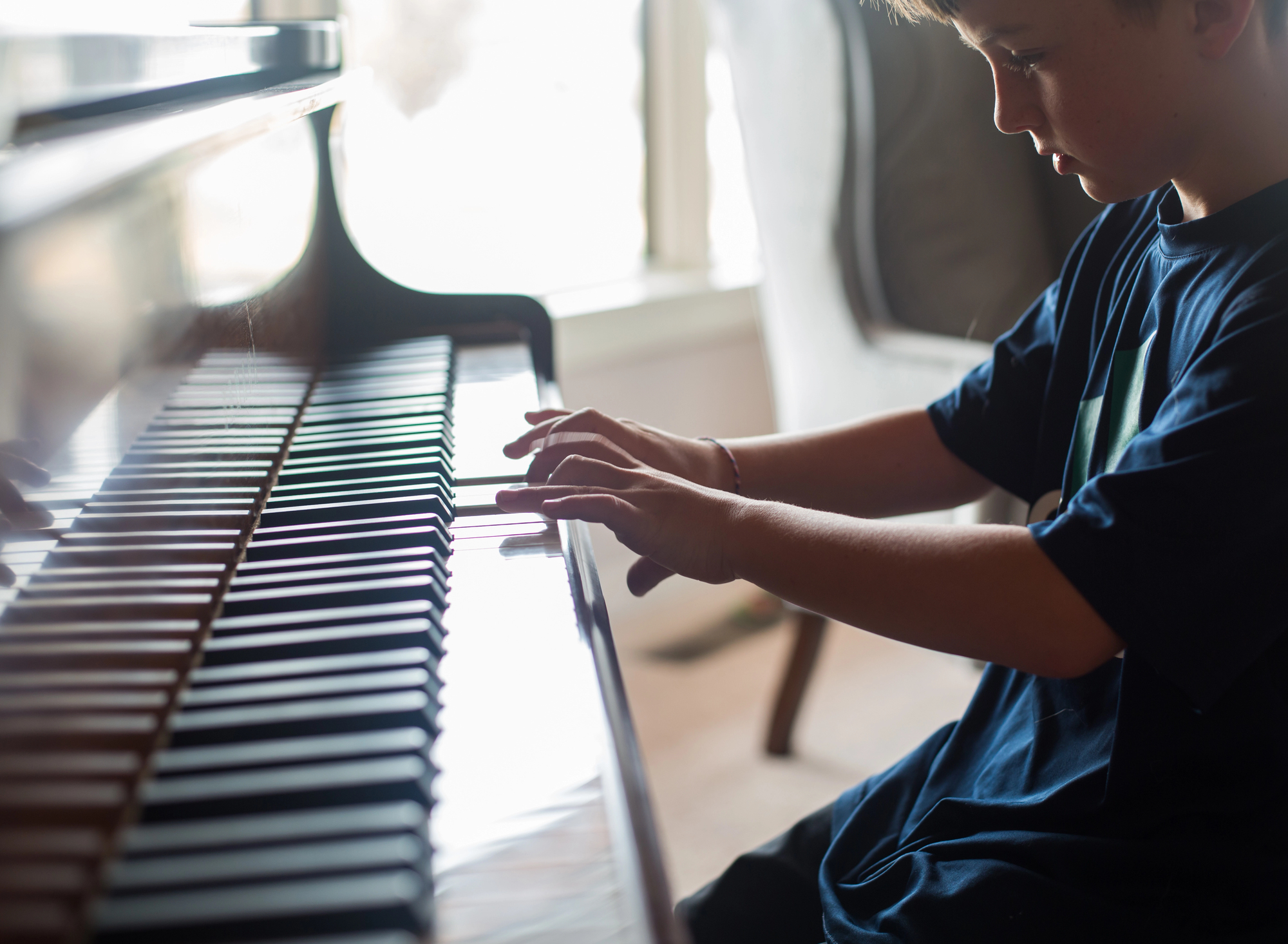 Children's hands playing piano